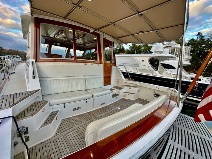 Moonshadow Yacht Photos Pics 2004 Grand Banks 49 Eastbay HX yacht with spacious deck and seating area.