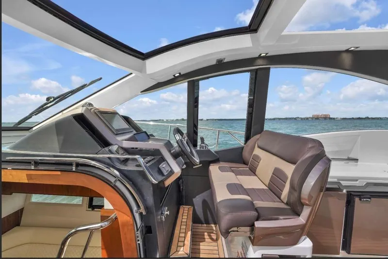 Empire Yacht Photos Pics Interior of 2017 Galeon 445 HTS yacht with modern helm and seating.