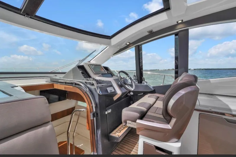 Empire Yacht Photos Pics 2017 Galeon 445 HTS yacht interior with modern helm and panoramic sea view.