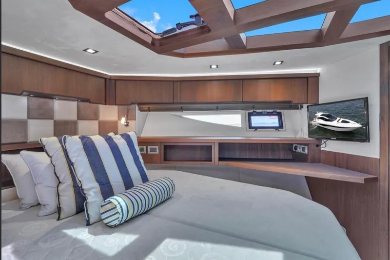 Empire Yacht Photos Pics Luxurious interior of 2017 Galeon 445 HTS yacht with elegant wood finishes and skylight.