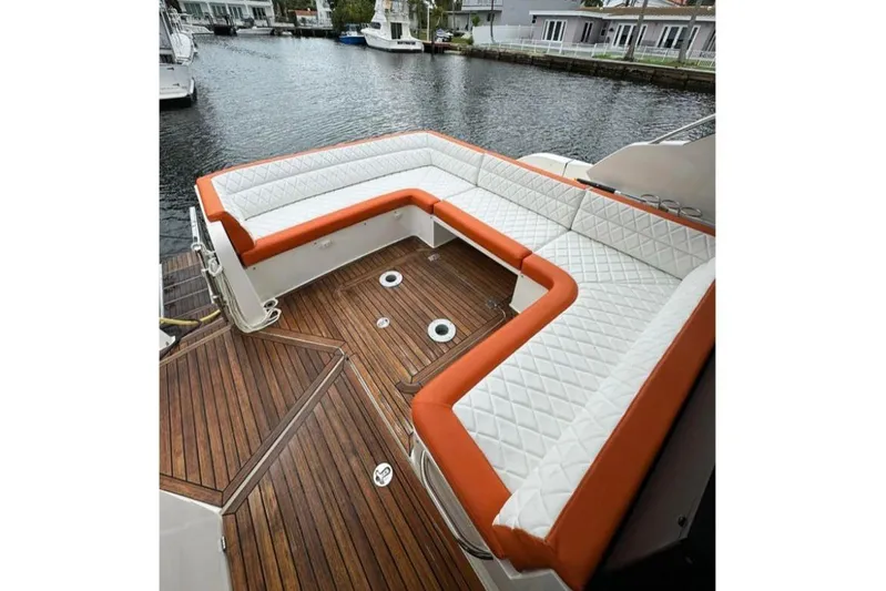 Empire Yacht Photos Pics Luxurious seating on 2017 Galeon 445 HTS yacht with quilted cushions and wooden deck.