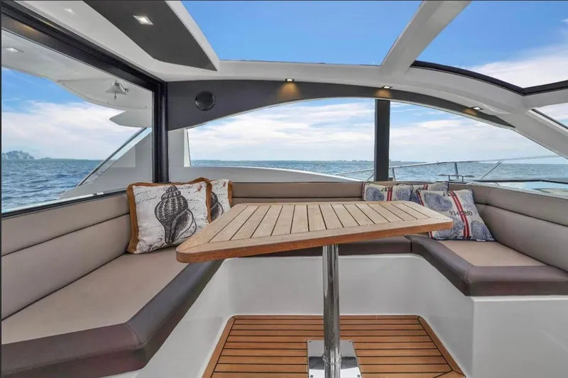 Empire Yacht Photos Pics Luxurious interior of 2017 Galeon 445 HTS yacht with ocean view and elegant seating.