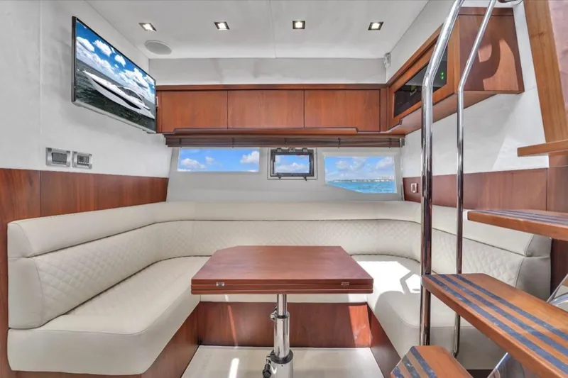 Empire Yacht Photos Pics Luxurious interior of 2017 Galeon 445 HTS yacht with elegant seating and wooden accents.