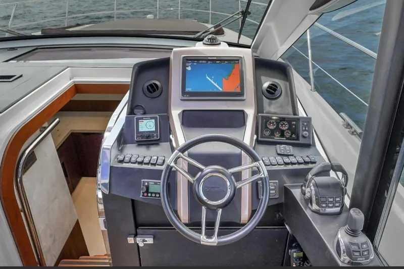 Empire Yacht Photos Pics Cockpit of 2017 Galeon 445 HTS yacht with navigation controls and steering wheel.