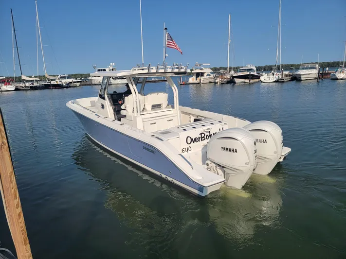 Over Bohr’d Yacht Photos Pics 2023 Pursuit S 328 Sport boat docked with twin Yamaha engines.