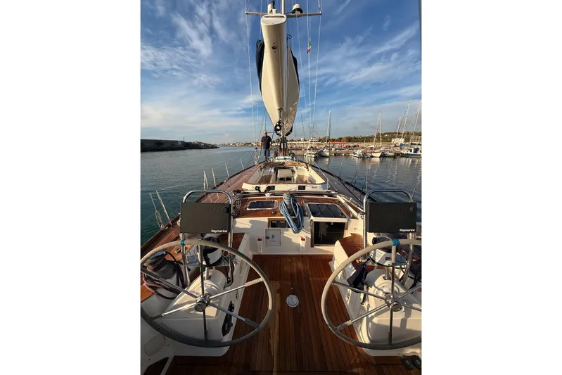 4961 Yacht Photos Pics Nautor Swan 60 yacht, 2000 model, docked in a marina under a blue sky.