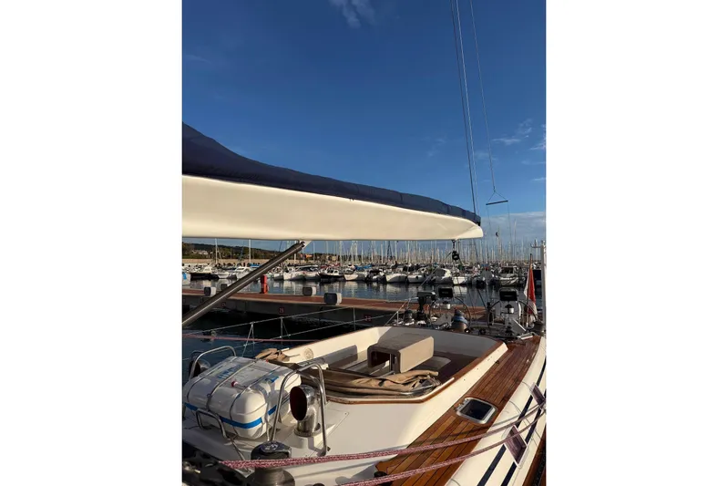 4961 Yacht Photos Pics Swan 60 yacht by Nautor Swan, 2000 model, docked in a marina under clear blue skies.