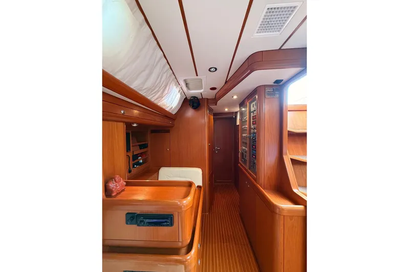 4961 Yacht Photos Pics Luxurious wooden interior of 2000 Nautor Swan 60 yacht, featuring elegant cabinetry and seating.