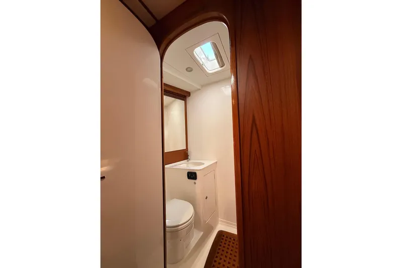 4961 Yacht Photos Pics Luxurious bathroom in 2000 Nautor Swan 60 yacht with wooden accents and skylight.