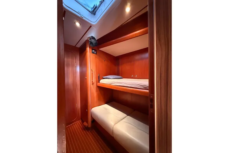 4961 Yacht Photos Pics Cozy wooden cabin interior of 2000 Nautor Swan 60 yacht with bunk beds.