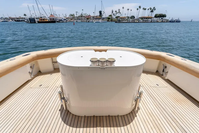 Reel Ranchin Yacht Photos Pics 2004 Hatteras 54 Convertible yacht deck with ocean view and marina backdrop.