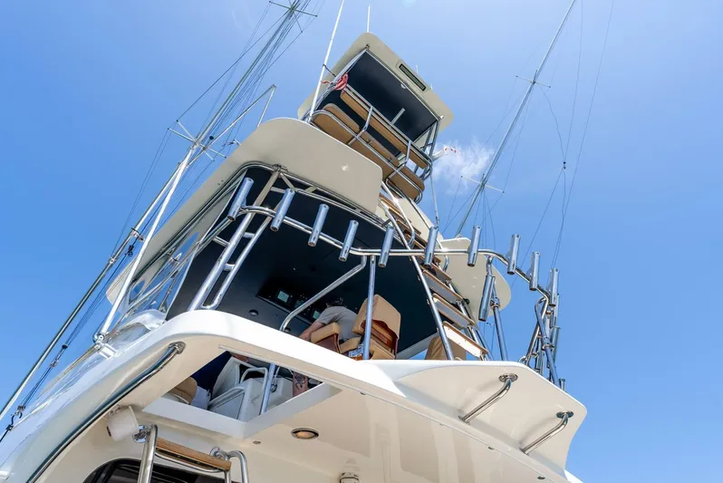 Reel Ranchin Yacht Photos Pics 2004 Hatteras 54 Convertible yacht tower against clear blue sky.