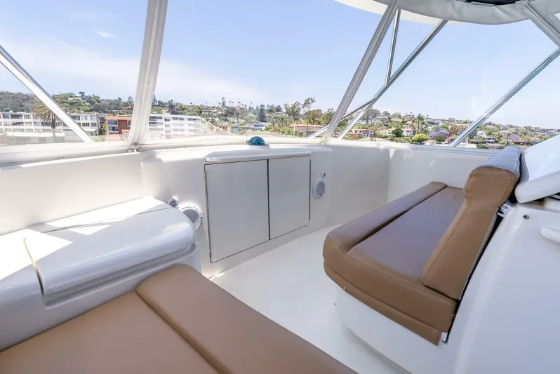 Reel Ranchin Yacht Photos Pics Interior view of 2004 Hatteras 54 Convertible yacht with seating and scenic windows.