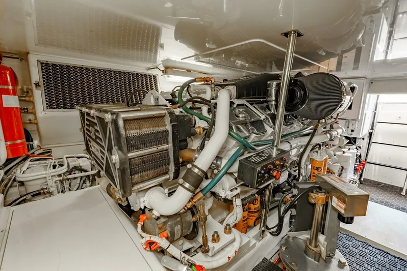 Reel Ranchin Yacht Photos Pics Engine room of 2004 Hatteras 54 Convertible yacht, showcasing detailed machinery and components.