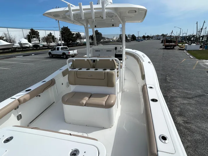 Salty Rim Yacht Photos Pics 2015 Sea Hunt Gamefish 30 boat with coffin box, parked in a marina lot.
