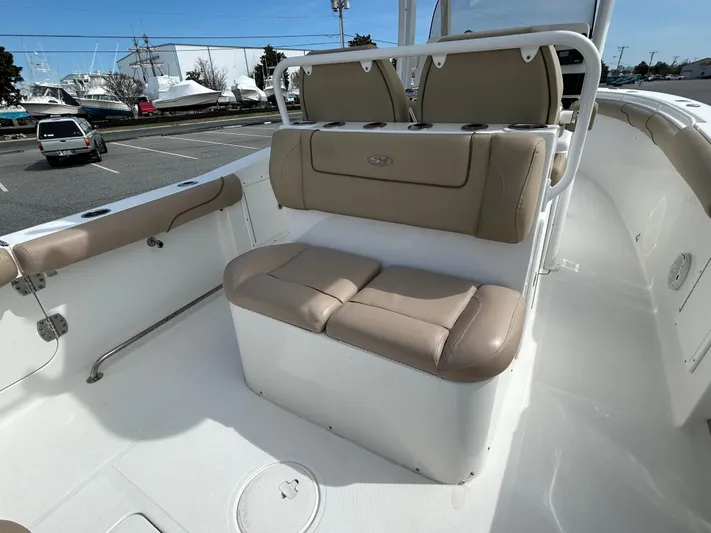 Salty Rim Yacht Photos Pics 2015 Sea Hunt Gamefish 30 interior with tan seating and coffin box.