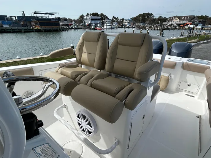 Salty Rim Yacht Photos Pics 2015 Sea Hunt Gamefish 30 boat interior with dual seats and steering wheel.