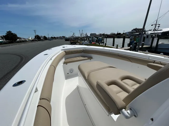 Salty Rim Yacht Photos Pics 2015 Sea Hunt Gamefish 30 with Coffin Box, docked, showcasing spacious seating and sleek design.