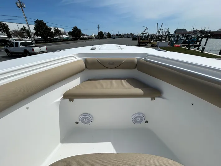 Salty Rim Yacht Photos Pics 2015 Sea Hunt Gamefish 30 boat interior with cushioned seating and speakers.