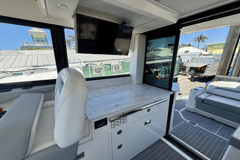  Yacht Photos Pics Interior of 2023 Regal 36 XO yacht with modern seating and entertainment area.
