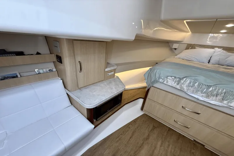  Yacht Photos Pics Interior of 2023 Regal 36 XO yacht with bed, seating, and storage.