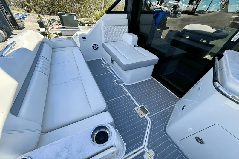  Yacht Photos Pics Luxurious interior of 2023 Regal 36 XO boat with white seating and modern design.