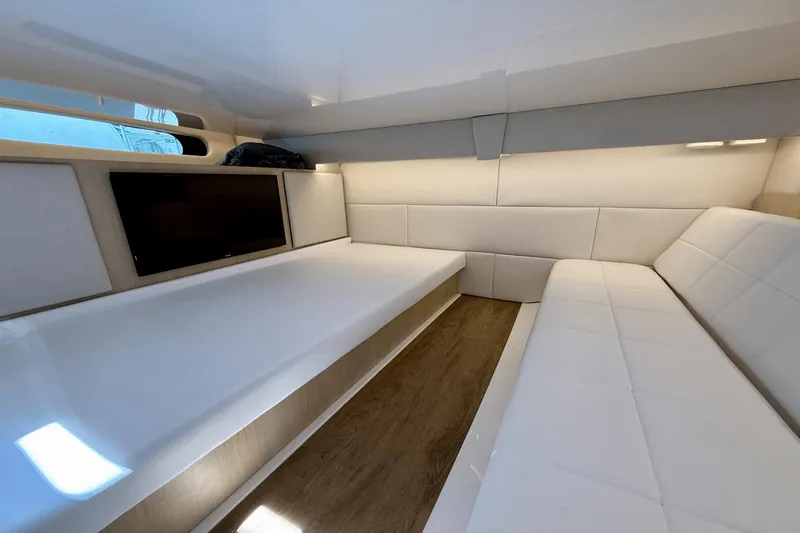 Yacht Photos Pics Luxurious interior of 2023 Regal 36 XO yacht with white seating and modern design.