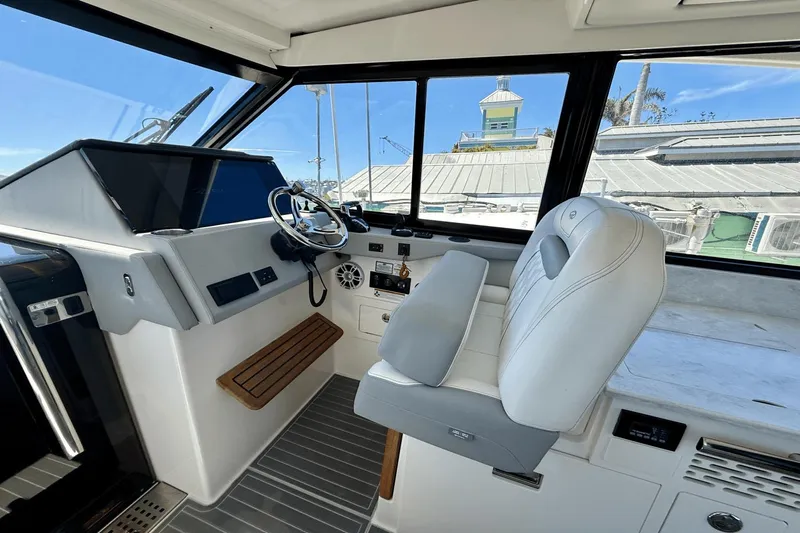  Yacht Photos Pics 2023 Regal 36 XO boat interior with modern helm and luxurious seating.