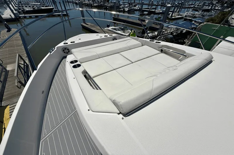  Yacht Photos Pics 2023 Regal 36 XO yacht with spacious sunbathing deck at marina.