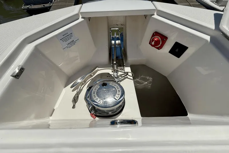  Yacht Photos Pics 2023 Regal 36 XO boat anchor compartment with winch and control panel.