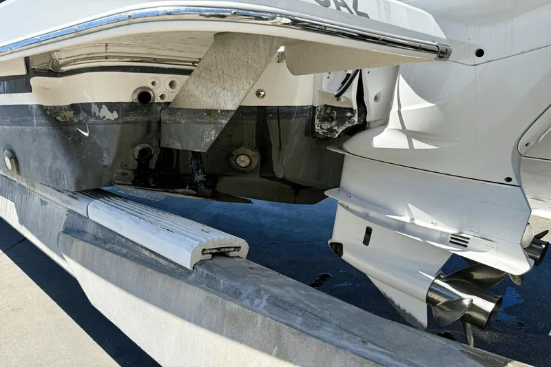  Yacht Photos Pics 2023 Regal 36 XO boat on trailer, showing stern and propeller details.