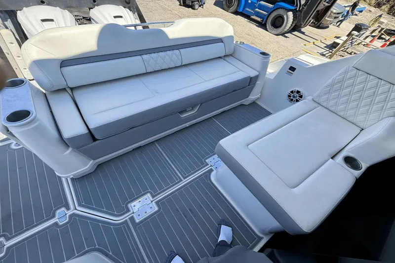  Yacht Photos Pics 2023 Regal 36 XO boat interior with luxurious seating and cup holders.