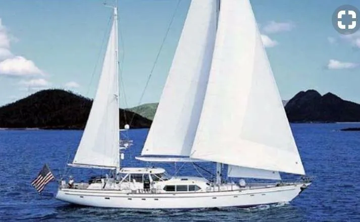 Sea Angel Yacht Photos Pics Sailing yacht Stephens Deck Saloon 1986 on blue ocean with islands in background.