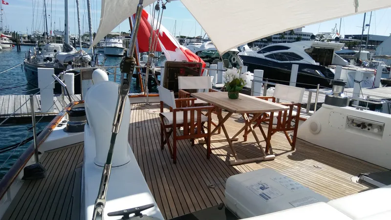 Sea Angel Yacht Photos Pics Luxurious 1986 Stephens Deck Saloon yacht with elegant outdoor seating and marina view.