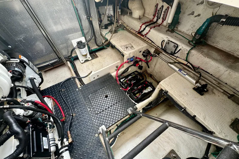  Yacht Photos Pics Engine room of 2006 Silverton 38 Sport Bridge, showcasing wiring and mechanical components.