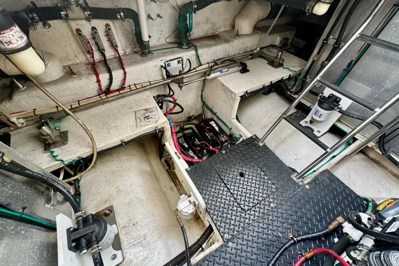  Yacht Photos Pics Engine room of a 2006 Silverton 38 Sport Bridge with visible wiring and components.