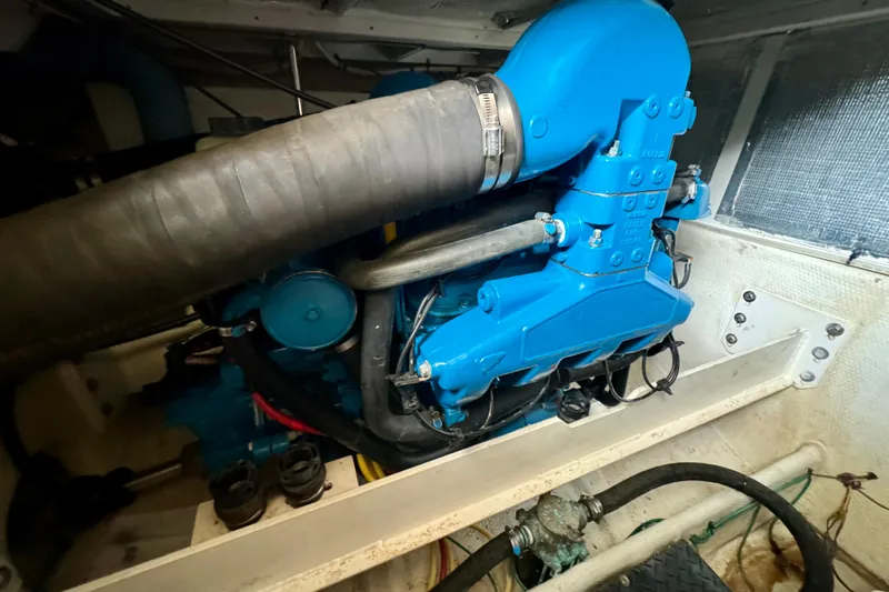  Yacht Photos Pics Engine compartment of a 2006 Silverton 38 Sport Bridge with blue machinery.