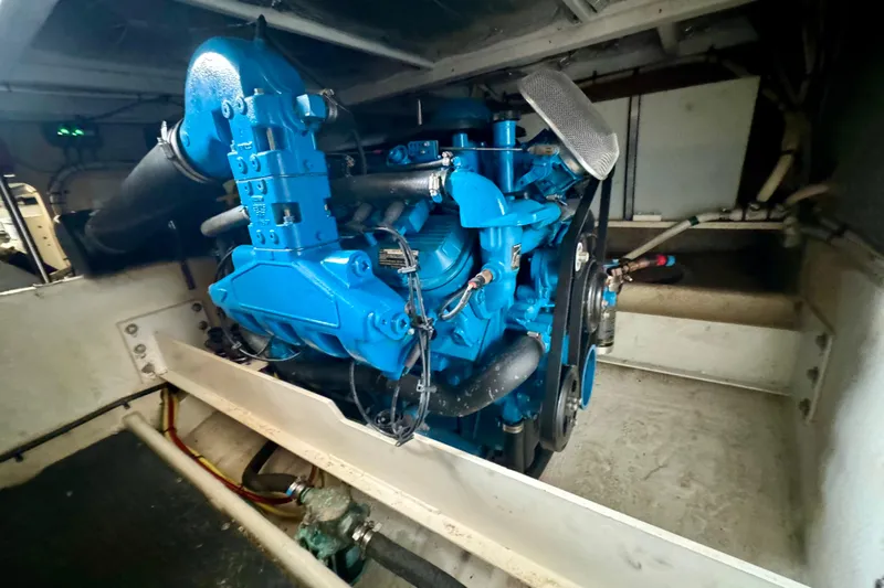  Yacht Photos Pics Engine compartment of a 2006 Silverton 38 Sport Bridge, featuring a blue marine engine.