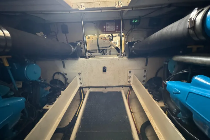  Yacht Photos Pics Engine room of a 2006 Silverton 38 Sport Bridge yacht, showcasing mechanical components.