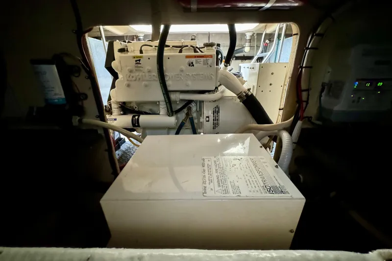  Yacht Photos Pics Engine room of a 2006 Silverton 38 Sport Bridge, showcasing mechanical components and wiring.