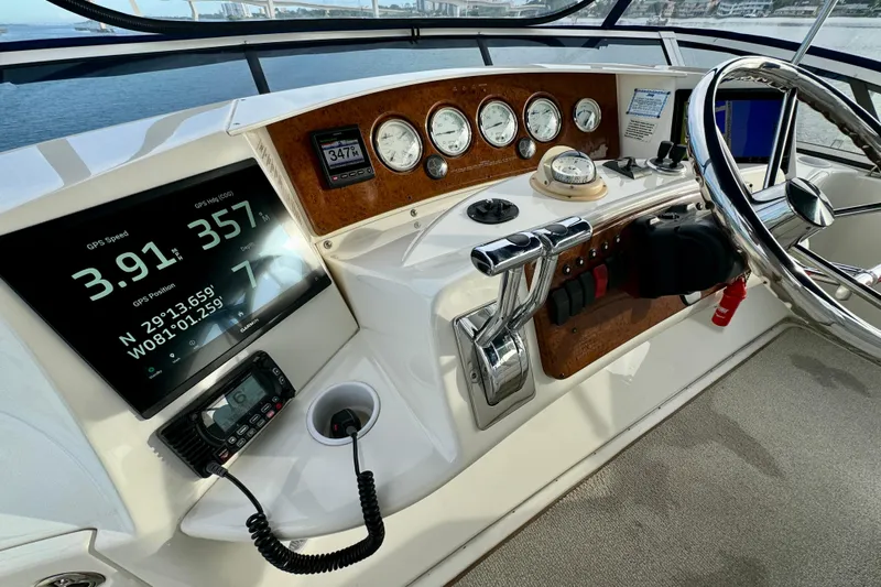  Yacht Photos Pics Helm of 2006 Silverton 38 Sport Bridge with GPS and navigation instruments.