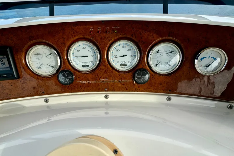  Yacht Photos Pics Dashboard of a 2006 Silverton 38 Sport Bridge with gauges and controls.