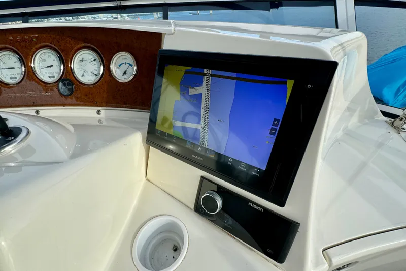  Yacht Photos Pics 2006 Silverton 38 Sport Bridge dashboard with navigation screen and gauges.