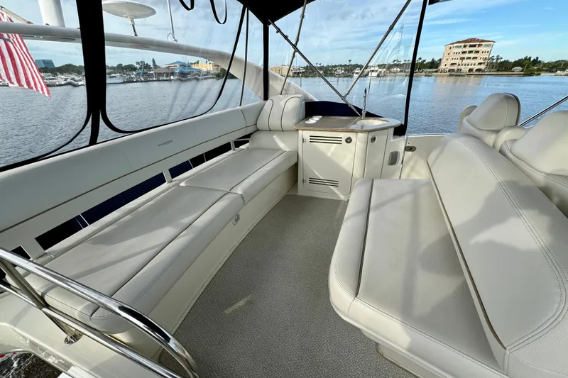 Yacht Photos Pics 2006 Silverton 38 Sport Bridge interior with spacious seating and waterfront view.