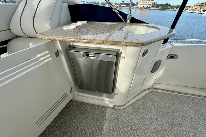  Yacht Photos Pics 2006 Silverton 38 Sport Bridge yacht interior with kitchenette and mini fridge.