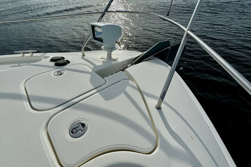  Yacht Photos Pics 2006 Silverton 38 Sport Bridge boat deck with water view and navigational equipment.