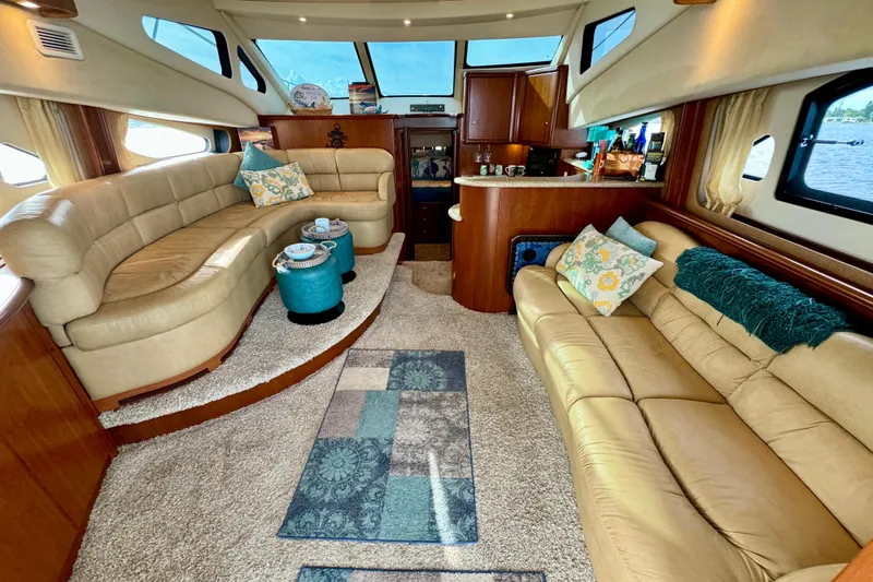  Yacht Photos Pics Luxurious interior of a 2006 Silverton 38 Sport Bridge yacht with plush seating and elegant decor.