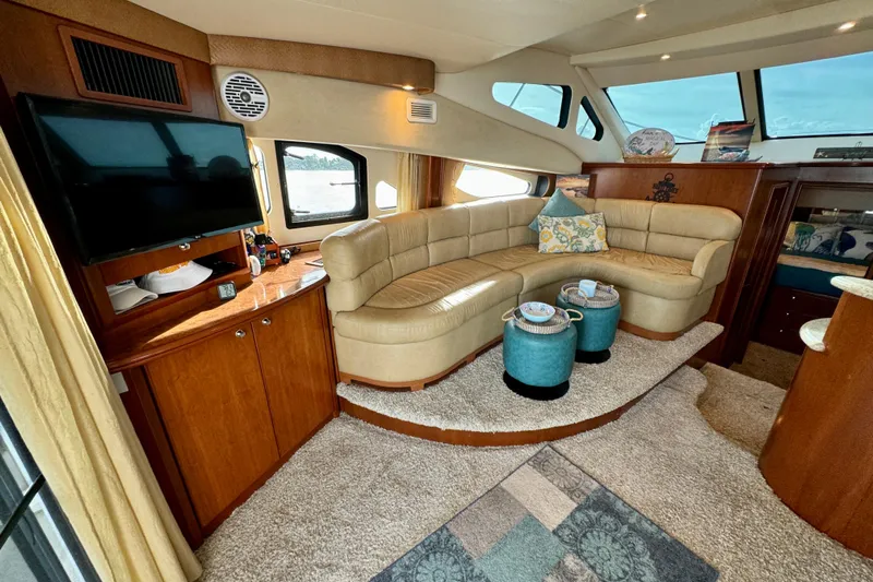  Yacht Photos Pics Luxurious interior of 2006 Silverton 38 Sport Bridge yacht with plush seating and modern amenities.