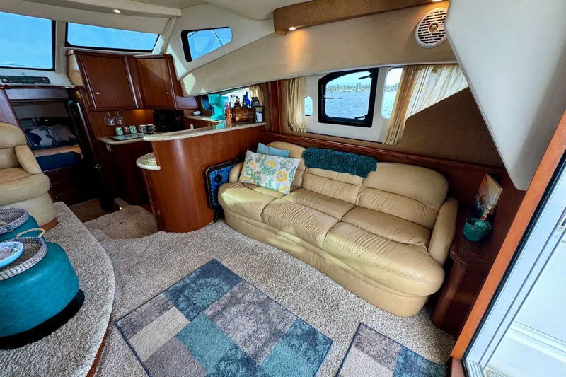  Yacht Photos Pics Luxurious interior of 2006 Silverton 38 Sport Bridge yacht with cozy seating and elegant decor.