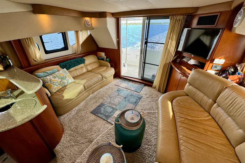  Yacht Photos Pics Luxurious interior of a 2006 Silverton 38 Sport Bridge yacht with plush seating and scenic view.